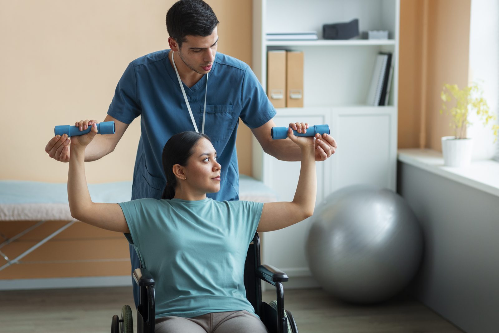 Physiotherapist guiding a patient's shoulder mobility exercise